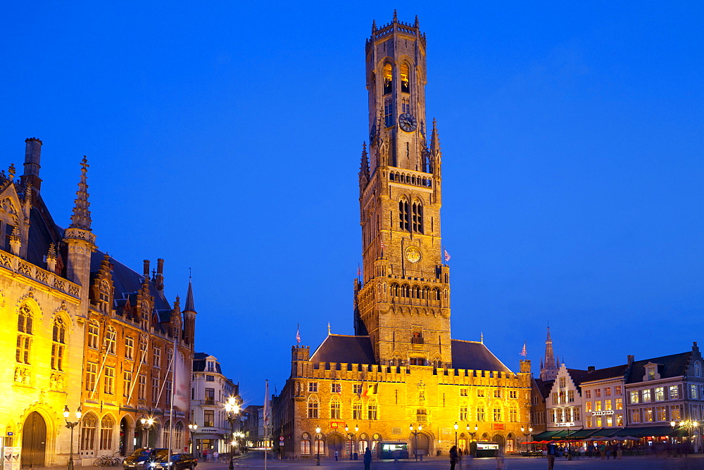 The Belfry and Market Square lit up at night in the Historic Center of Bruges, UNESCO World Heritage Site, Belgium, Europe