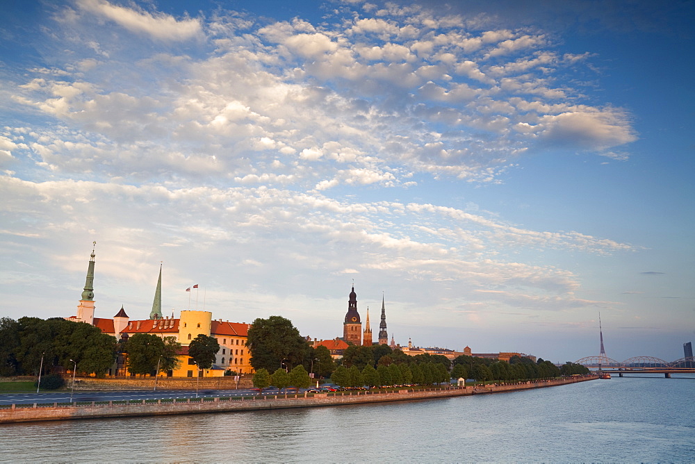 Riga Castle and the River Daugava illuminated at sunset, Riga, Latvia, Europe