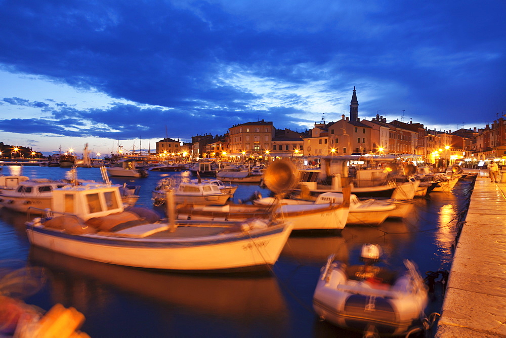 Ships and boats at the harbour and the old town with cathedral of St. Euphemia at dusk, Rovinj, Istria, Croatia, Adriatic, Europe 