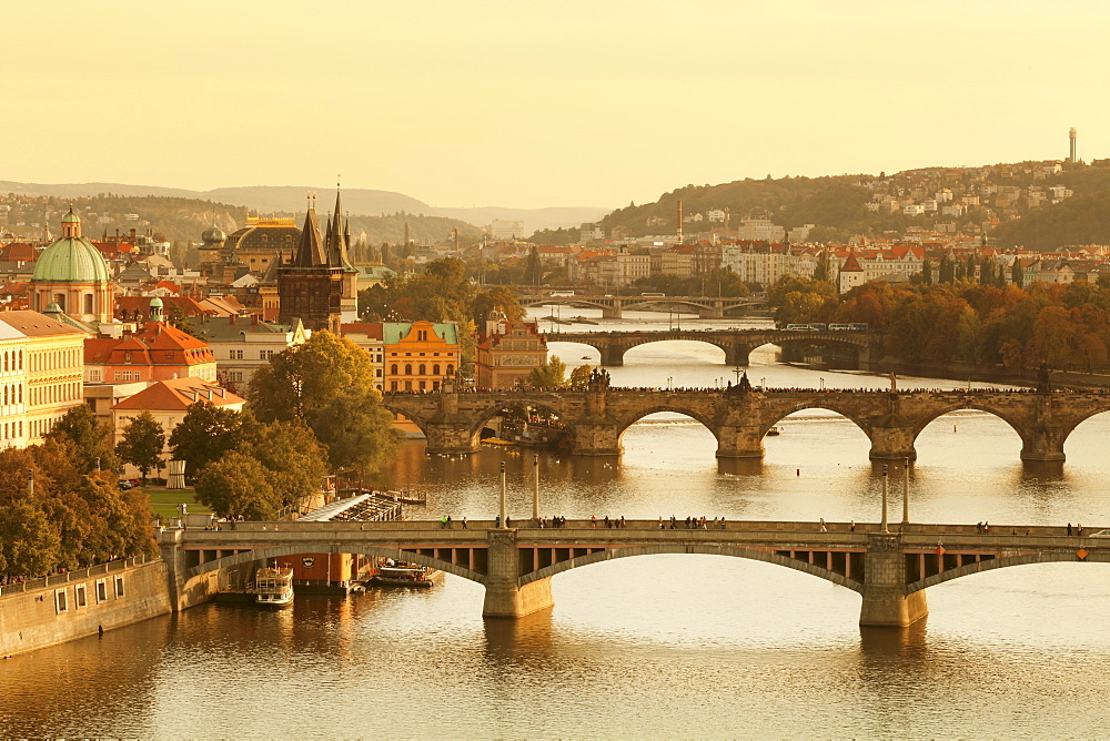 Bridges over the Vltava River including Charles Bridge, UNESCO World Heritage Site, and Old Town Bridge Tower at sunset, Prague, Bohemia, Czech Republic, Europe 