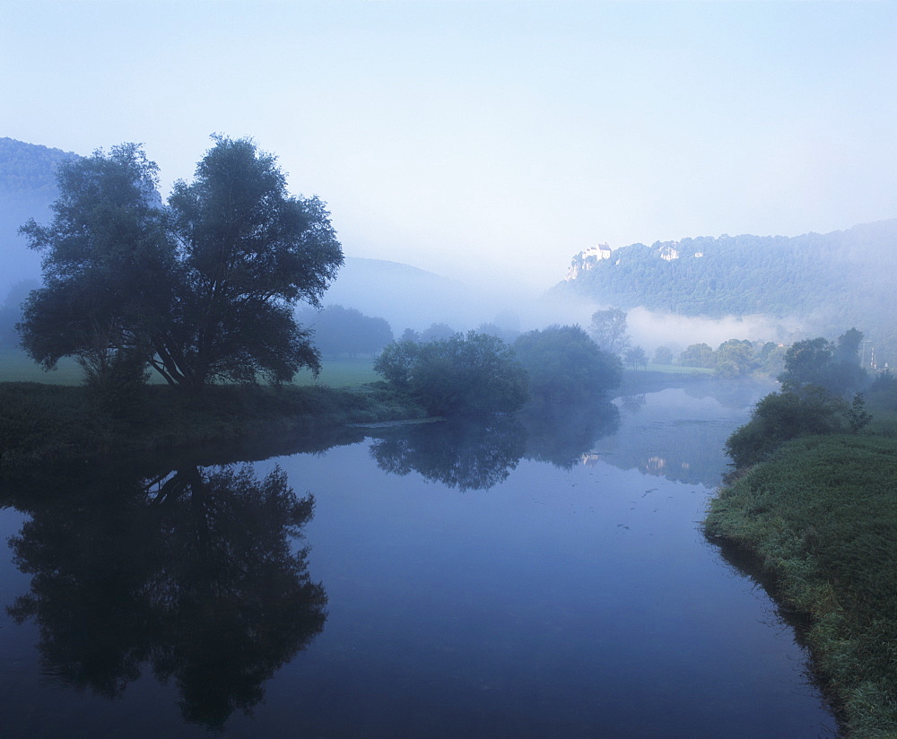 Schloss Werenwag Castle reflecting in Danube River, Danube Valley, Upper Danube Nature Park, Swabian Alb, Baden Wurttemberg, Germany, Europe