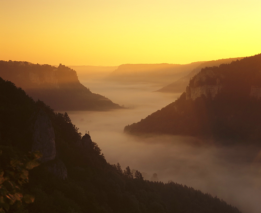 View from Eichfelsen Rock on Schloss Werenwag Castle and Danube Valley at sunrise, Upper Danube Nature Park, Swabian Alb, Baden Wurttemberg, Germany, Europe