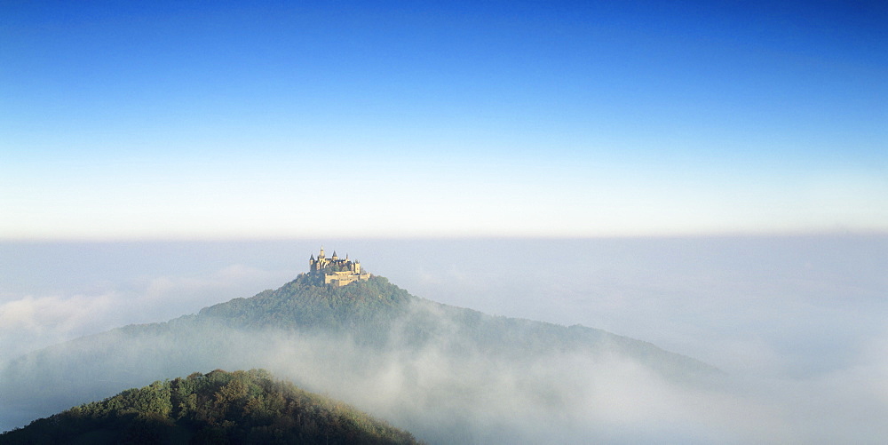 Hohenzollern Castle in early morning fog, Hechingen, Swabian Alb, Baden Wurttemberg, Germany, Europe