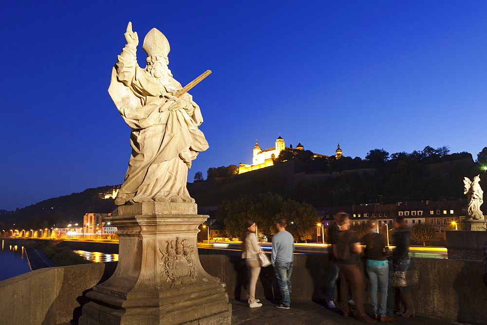 Figure of the St. Kilian, Baroque sculpture on the Old Bridge over Main River (Alte Mainbruecke), Marienberg Fortress, Wurzburg, Franconia, Bavaria, Germany, Europe