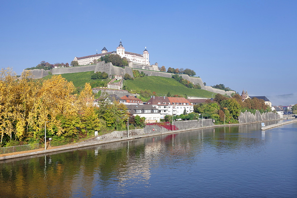 View over the Main River to Marienberg Fortress in autumn, Wuerzburg, Franconia, Bavaria, Germany, Europe