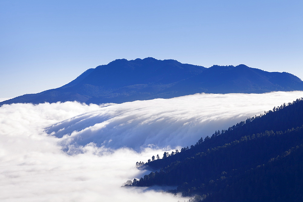 View from Caldera de Taburiente at cloud waterfall of Cumbre Nueva, Parque Nacional de la Caldera de Taburiente, La Palma, Canary Islands, Spain, Europe