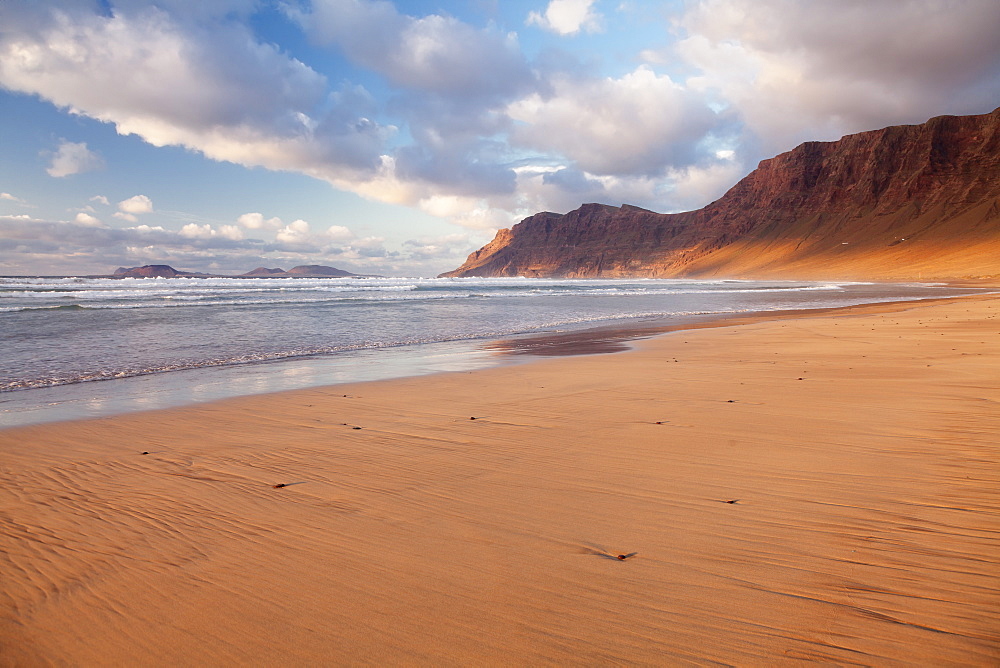 Famara Beach and Famara Mountains at sunset, view to La Graciosa Island, Lanzarote, Canary Islands, Spain, Atlantic, Europe