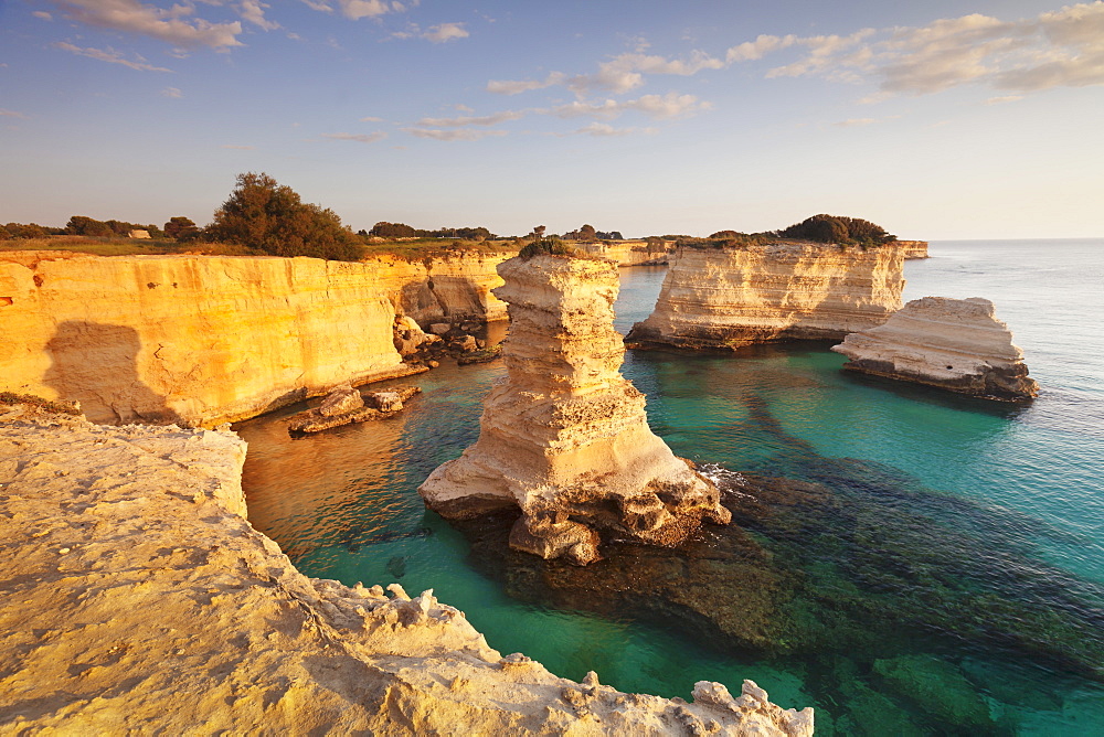 Rocky columns, natural monument, rocky coast at sunrise, Sant'Andrea, Adriatic Sea, Lecce province, Salentine Peninsula, Puglia, Italy, Europe