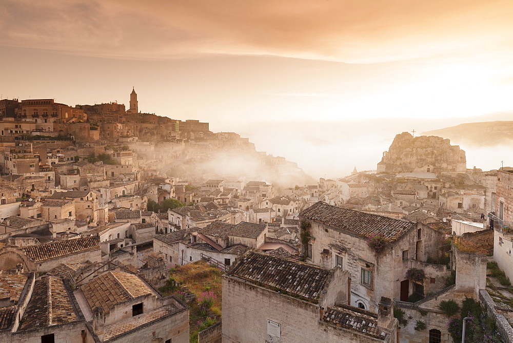 View over Sasso Caveoso to Monte Errone and cathedral at sunrise, UNESCO World Heritage Site, Matera, Basilicata, Puglia, Italy, Europe