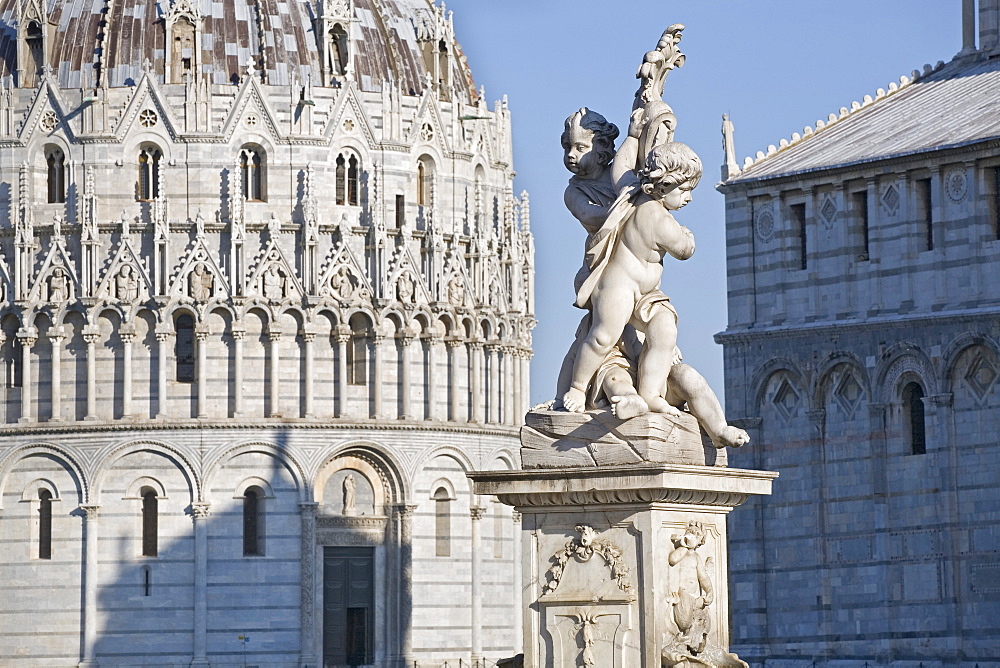 Two sculptures of angels between Duomo Santa Maria Assunta and Battistero (Baptistery), Campo dei Miracoli, UNESCO World Heritage Site, Pisa, Tuscany, Italy, Europe