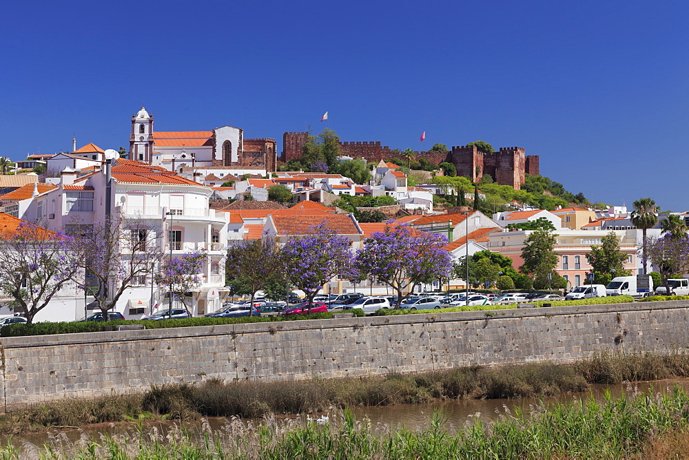 View over Rio Arade river to the cathedral and castle, Silves, Algarve, Portugal, Europe