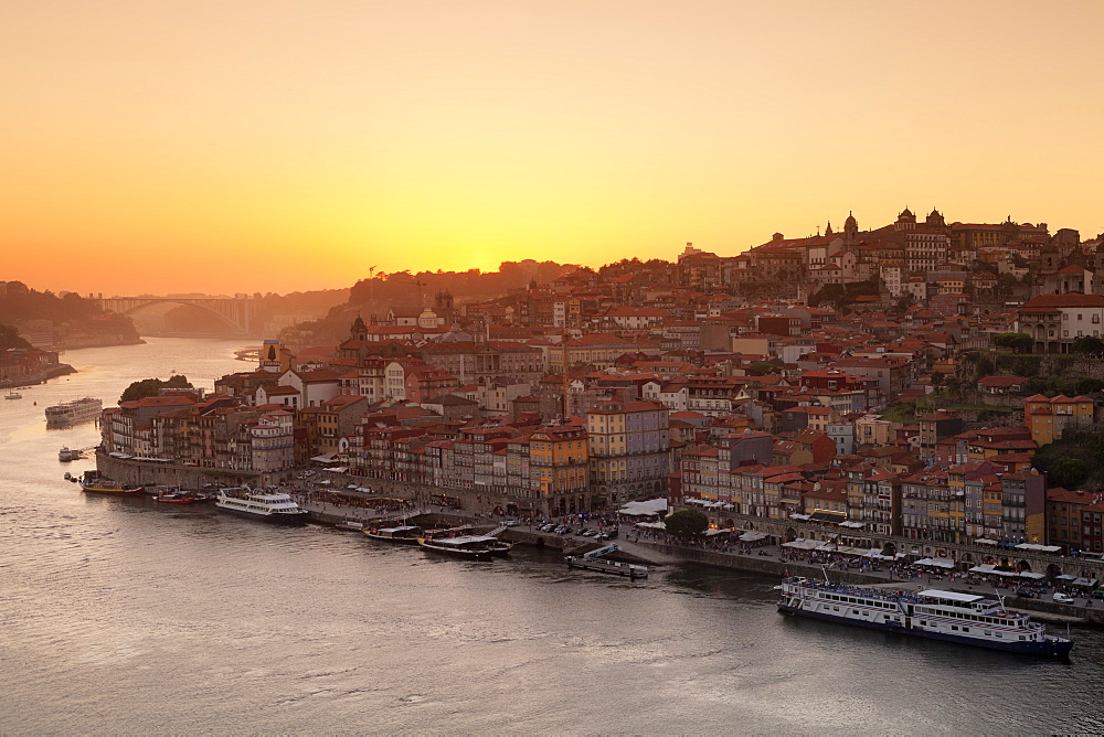 View over Douro River at sunset to Ribeira District, UNESCO World Heritage Site, Porto (Oporto), Portugal, Europe