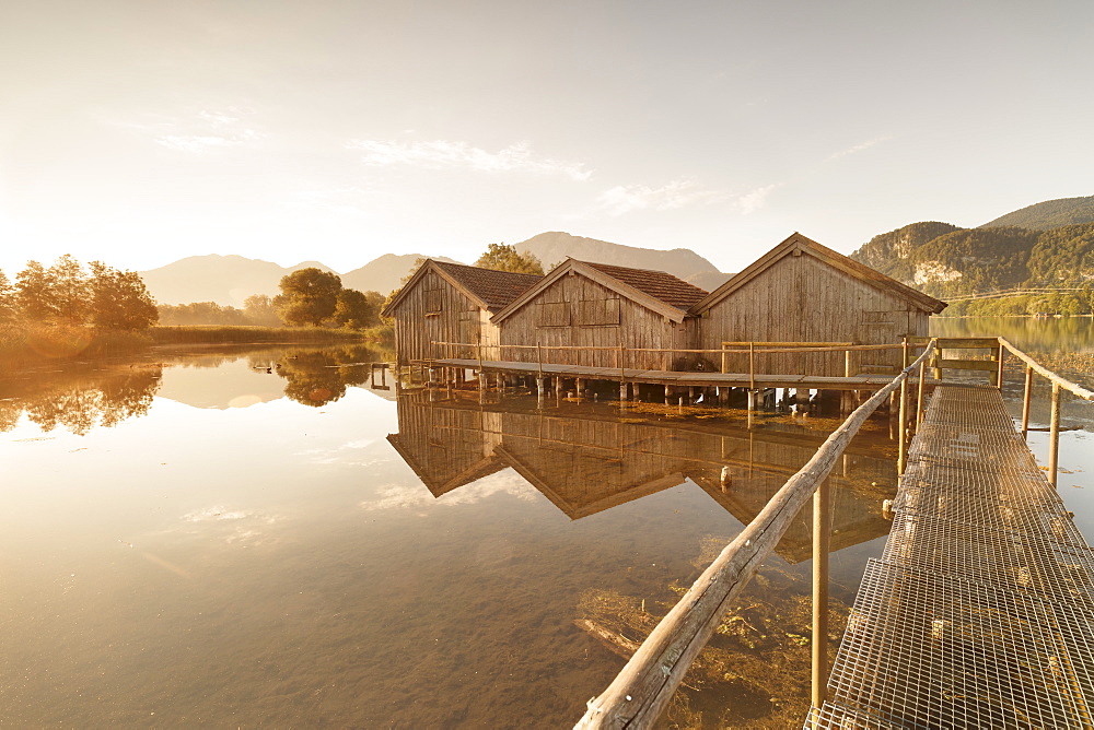 Boathouses at Kochelsee Lake at sunrise, Upper Bavaria, Bavaria, Germany, Europe