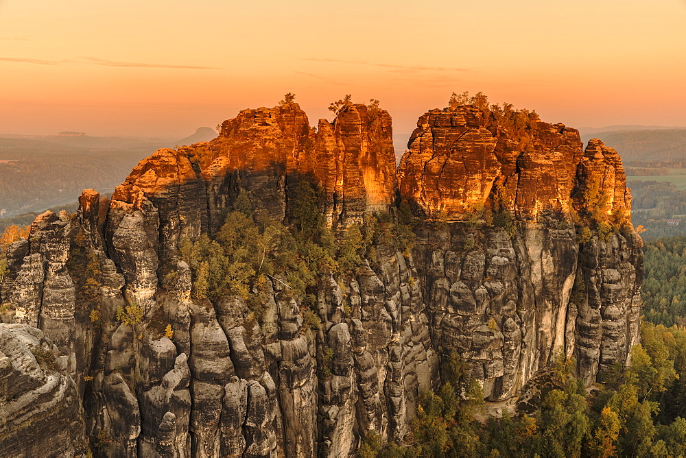 Schrammstein rocks at sunrise in Elbe Sandstone Mountains, Germany, Europe