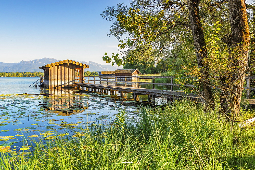 Boat houses on a jetty, Lake Chiemsee, Upper Bavaria, Germany, Europe