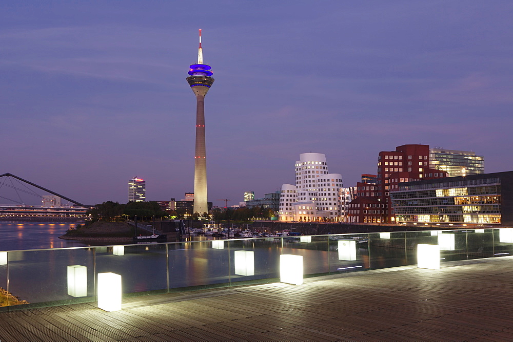 Media Harbour (Medienhafen), Neuer Zollhof building designed by Frank Gehry and Rhineturm tower, Dusseldorf, North Rhine Westphalia, Germany, Europe