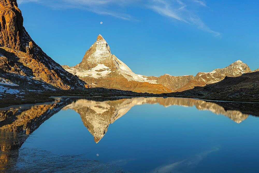 Lake Riffelsee with Matterhorn (4478m) at sunrise, Zermatt, Valais, Swiss Alps, Switzerland