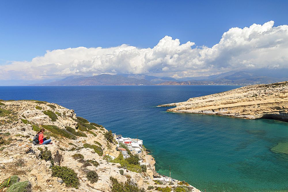 Tourist enjoying the view of the bay of Matala, Iraklion, Crete, Greek Islands, Greece, Europe