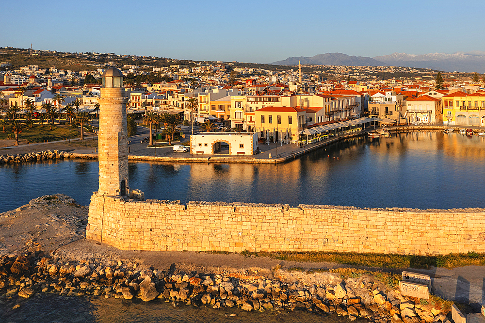 Lighthouse at the Venetian harbor with a view over, Rethymno, Crete, Greek Islands, Greece, Europe