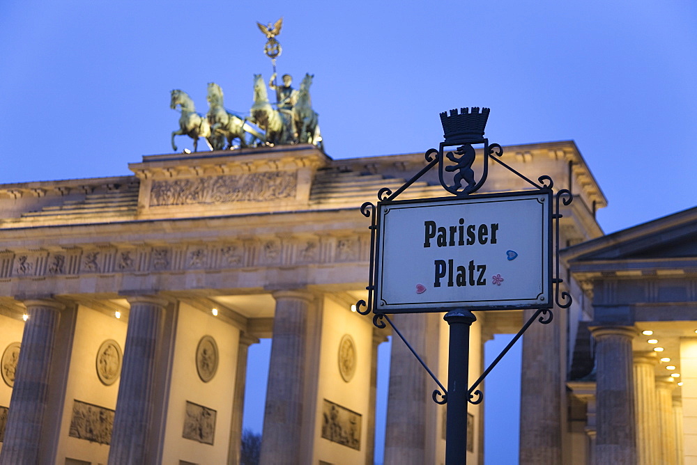 Brandenburg Gate (Brandenburger Tor) and Quadriga winged victory and road sign Pariser Platz, Unter den Linden, Berlin, Germany, Europe