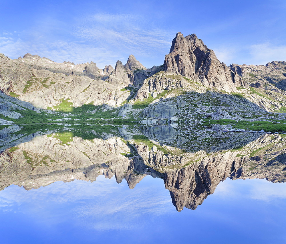 Pic Lombarduccio reflecting in Lac de Melo, Gorges de la Restonica, Haute Corse, Corsica, France, Europe