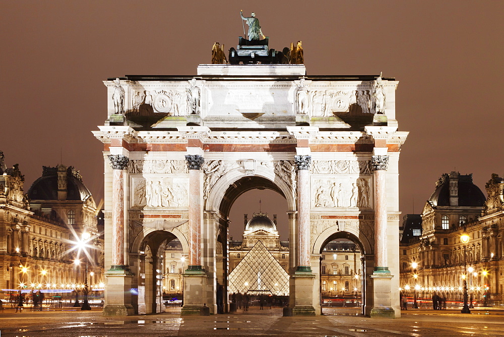 Illuminated Arc de Triomphe du Carousel and Louvre Museum with Pyramid at night, Paris, Ile de France, France, Europe 