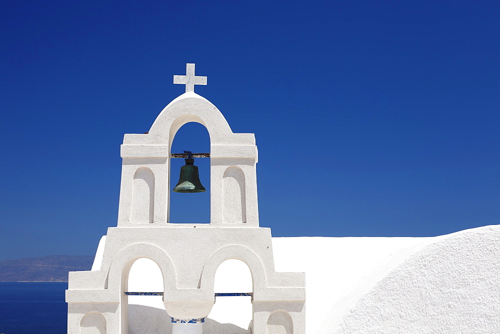 Bell tower of a white church, Oia, Santorini, Cyclades, Aegean Sea, Greek Islands, Greece, Europe 