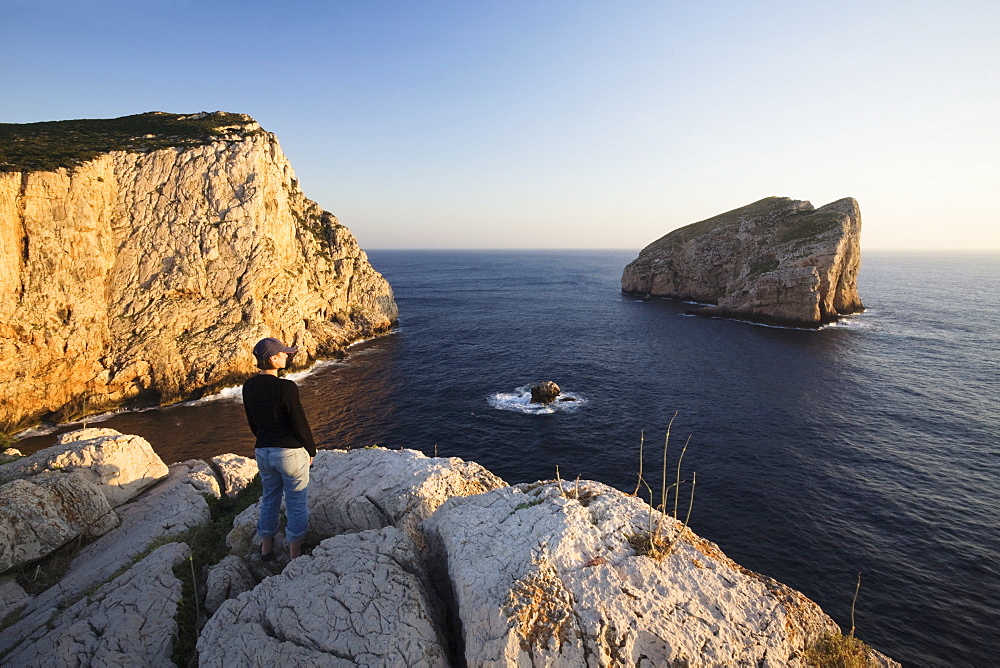 Woman enjoying the sunset, Capo Caccia, Province Nurra, Sardinia, Italy, Mediterranean, Europe 