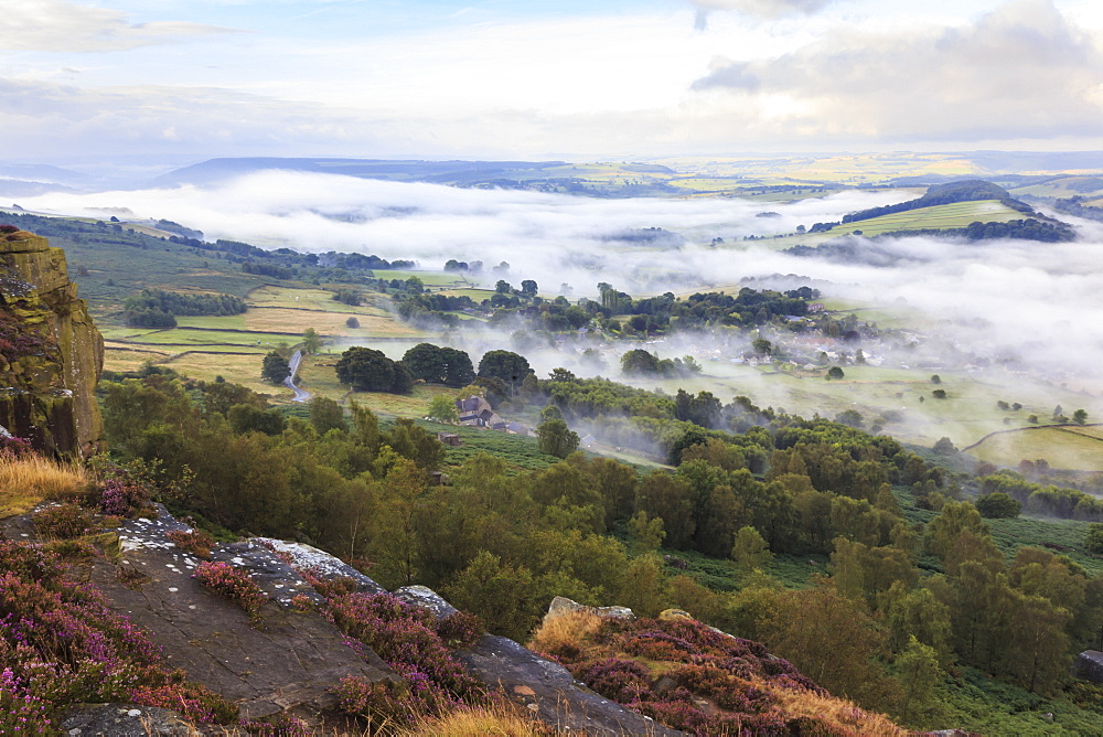 Early morning fog around Curbar village, from Curbar Edge, Peak District National Park, late summer heather, Derbyshire, England, United Kingdom, Europe