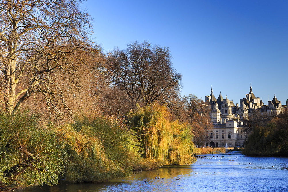 St. James's Park, with view across lake to Horse Guards, sunny late autumn, Whitehall, London, England, United Kingdom, Europe