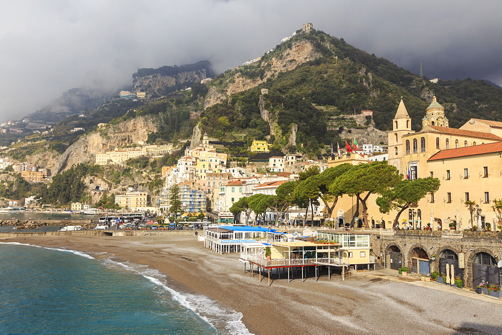 Amalfi waterfront in spring sun, with mist shrouded mountains, Amalfi Coast, UNESCO World Heritage Site, Campania, Italy, Europe