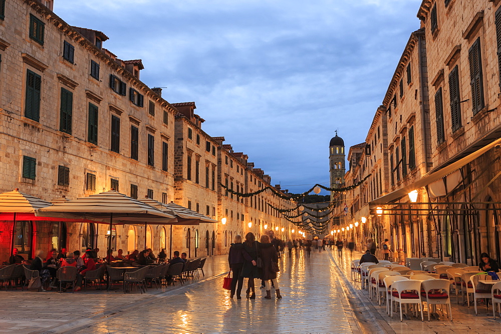 Cafes on Stradun (Placa), pedestrian promenade, evening blue hour, Old Town, Dubrovnik, UNESCO World Heritage Site, Croatia, Europe