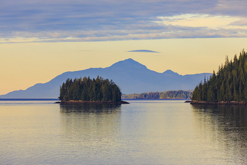 Sunrise, entering the Misty Fjords National Monument, islands, forest and distant mountains, Ketchikan, Southeast Alaska, United States of America, North America