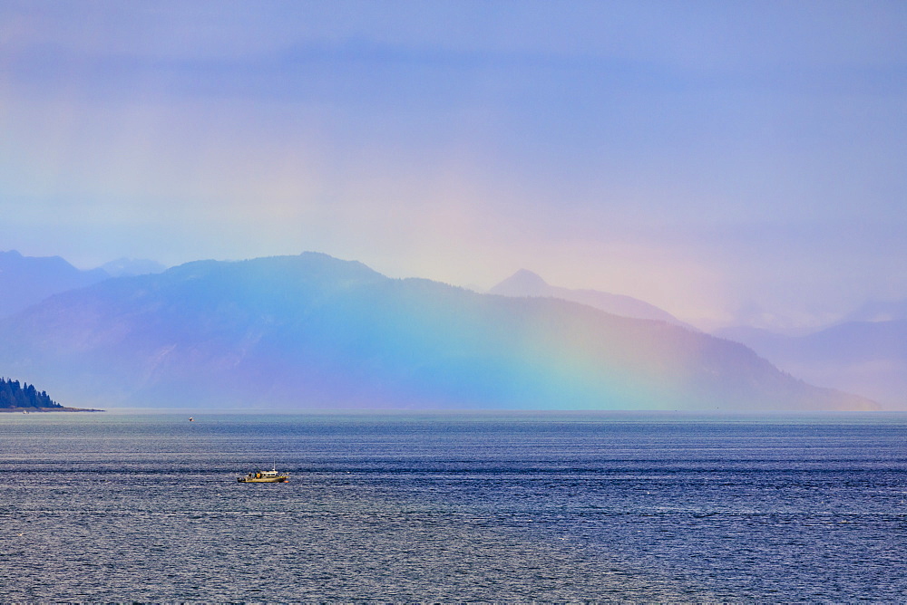 Boat, huge rainbow colours light up mist over the Fairweather Range, Icy Strait, near Glacier Bay, Inside Passage, Alaska, United States of America, North America