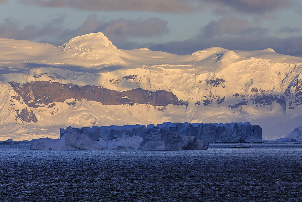 Sunrise, with atmospheric cloud and mist, mountains, glaciers and icebergs, Andvord Bay, Graham Land, Antarctica, Polar Regions