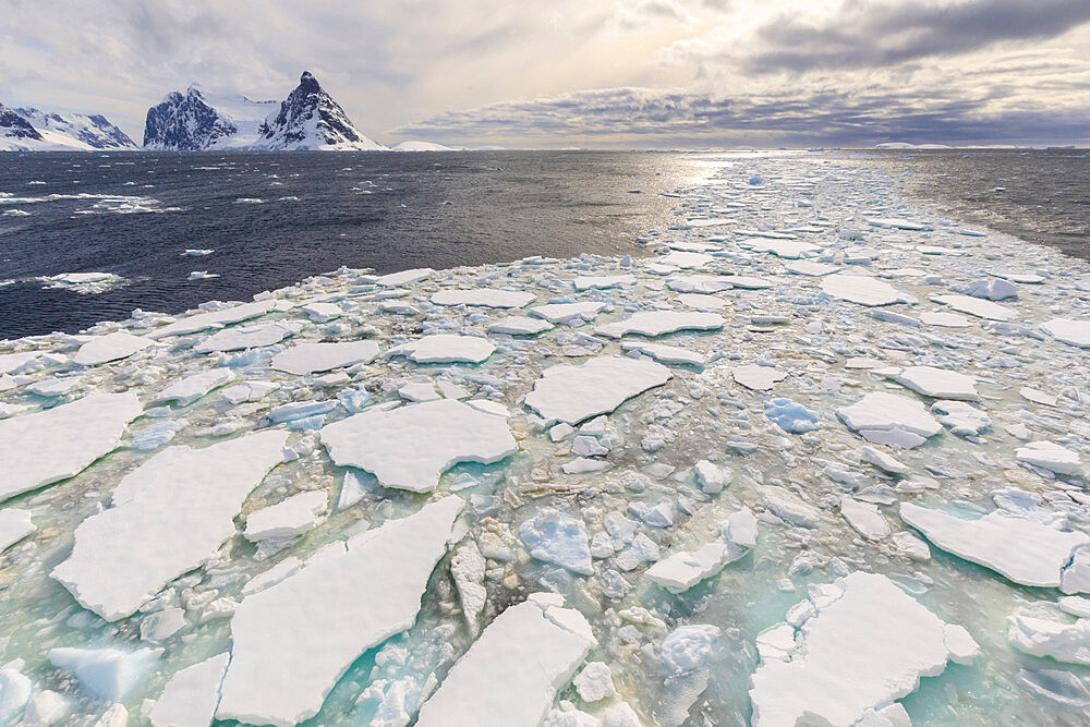 Sea ice and Lemaire Channel entrance, between Kiev Peninsula and Booth Island, evening light, Antarctic Peninsula, Antarctica, Polar Regions