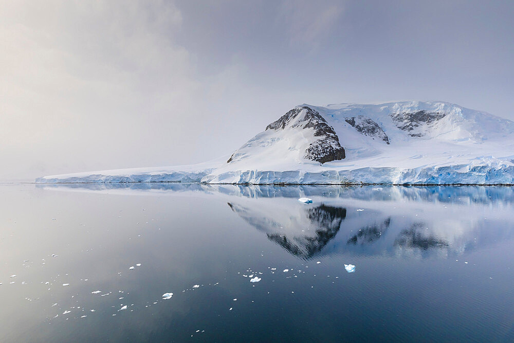 Misty evening reflections, Neumayer Channel between Anvers Island and Wiencke Island, Antarctic Peninsula, Antarctica, Polar Regions