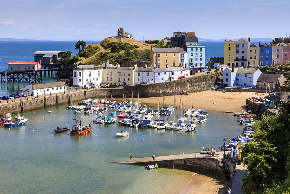 Harbour Beach, boats, colourful historic buildings, Castle Hill, lifeboat station on a sunny day, Tenby, Pembrokeshire, Wales, Europe