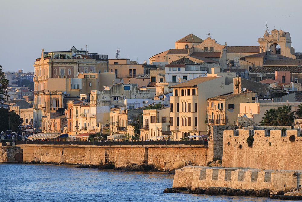 Sunset lights up Ortigia (Ortygia), from the sea, Syracuse (Siracusa), UNESCO World Heritage Site, Sicily, Italy, Mediterranean, Europe