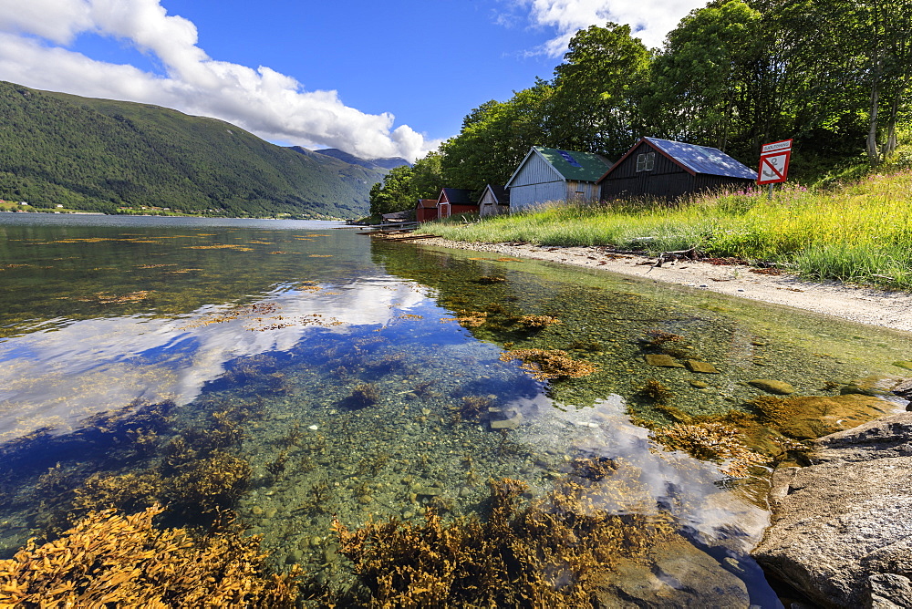 Old wooden boat houses, Romsdalsfjord (Romsdal Fjord), Andalsnes, More og Romsdal, Norway, Scandinavia, Europe