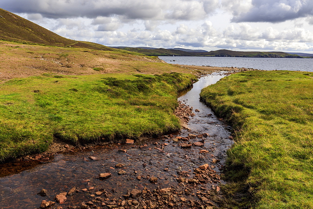 Little Ayre, burn, red sand and granite beach and rocks, Muckle Roe Island, Shetland Isles, Scotland, United Kingdom, Europe