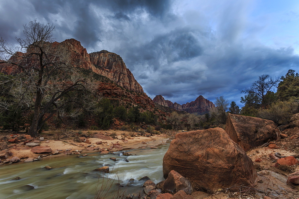 Dusk beside the Virgin River under a threatening sky in winter, Zion National Park, Utah, United States of America, North America