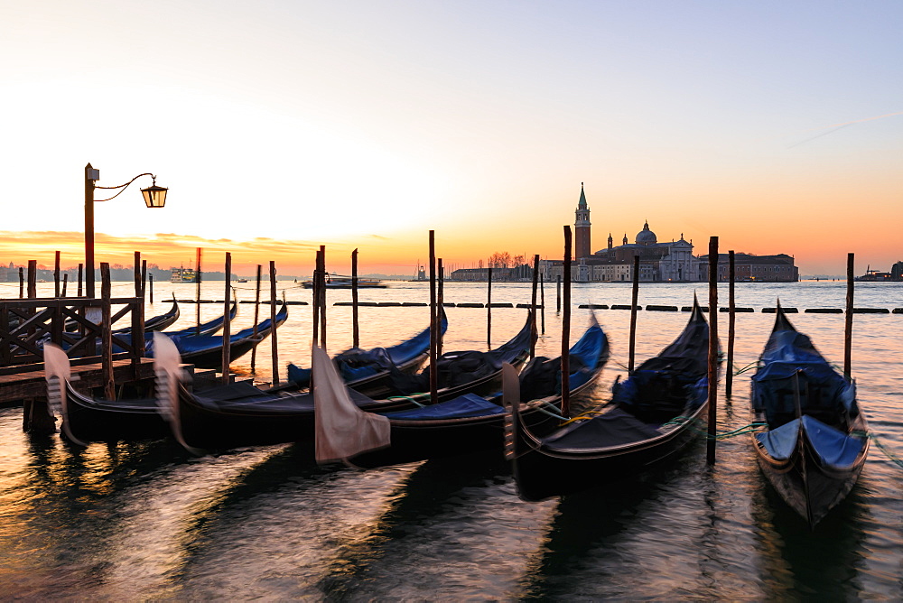 Beautiful Venetian sunrise in winter, gondolas, San Giorgio Maggiore and Lido, Venice, UNESCO World Heritage Site, Veneto, Italy, Europe