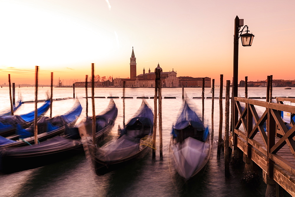 Beautiful Venetian sunrise in winter, gondolas, San Giorgio Maggiore and Lido, Venice, UNESCO World Heritage Site, Veneto, Italy, Europe