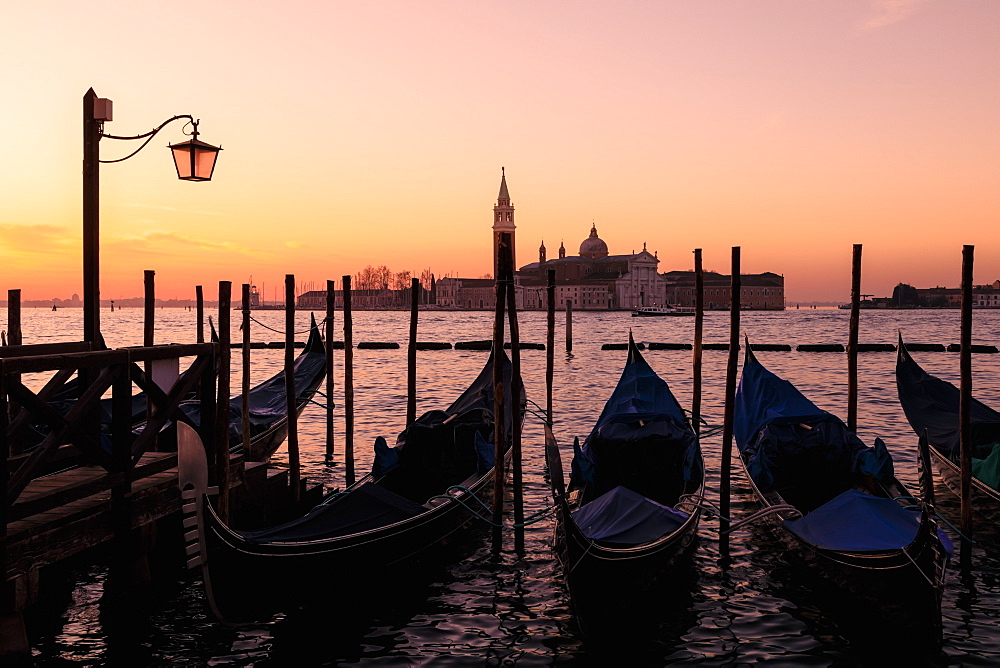 Beautiful Venetian sunrise in winter, gondolas, San Giorgio Maggiore and Lido, Venice, UNESCO World Heritage Site, Veneto, Italy, Europe