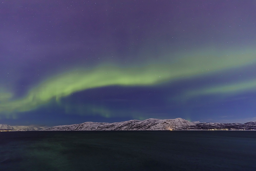 Northern Lights (Aurora Borealis) over mountains of Altafjord in winter, Alta, Troms og Finnmark, Arctic Circle, North Norway, Scandinavia, Europe