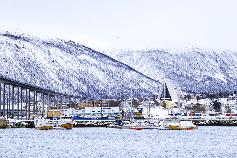 Tromso, small boat harbour, fjord, bridge, Arctic Cathedral, deep snow in winter, Tromso, Troms og Finnmark, Arctic Circle, North Norway, Scandinavia, Europe