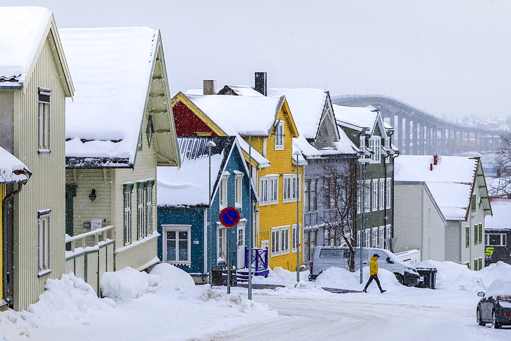 Historic colourful wooden houses, Bridge, heavy snow in winter, Tromso, Troms og Finnmark, Arctic Circle, North Norway, Scandinavia, Europe