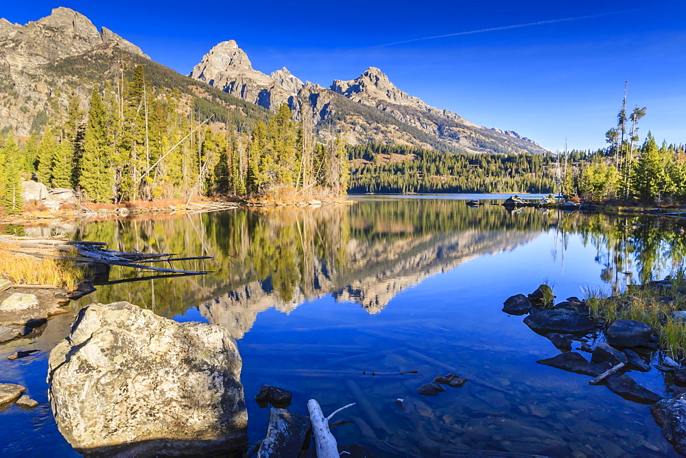 Reflections of the Teton Range in Taggart Lake, Grand Teton National Park, Wyoming, United States of America, North America