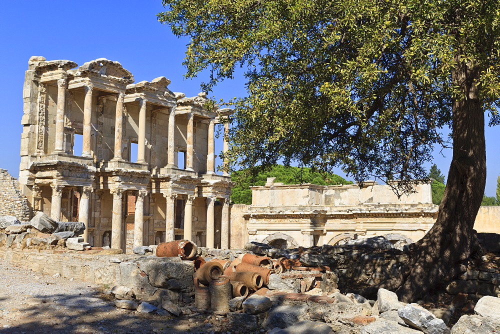 Facade of the Library of Celsus, fruit tree and ancient pipes, ancient Ephesus, near Kusadasi, Anatolia, Turkey, Asia Minor, Eurasia